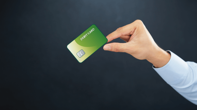 why do vending machines charge extra for debit cards